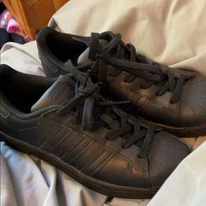 all black adidas superstars